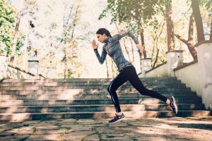 A woman running outside in the city.